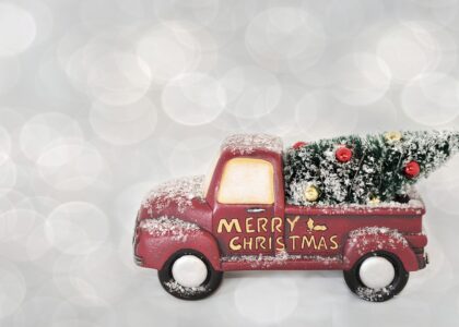 red cartoon lorry on white sparkly background